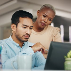 Laptop, reading or business people focus on website development, ecommerce teamwork or online brand